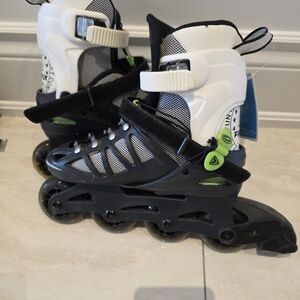 Black and White Inline Skates with Green Accents